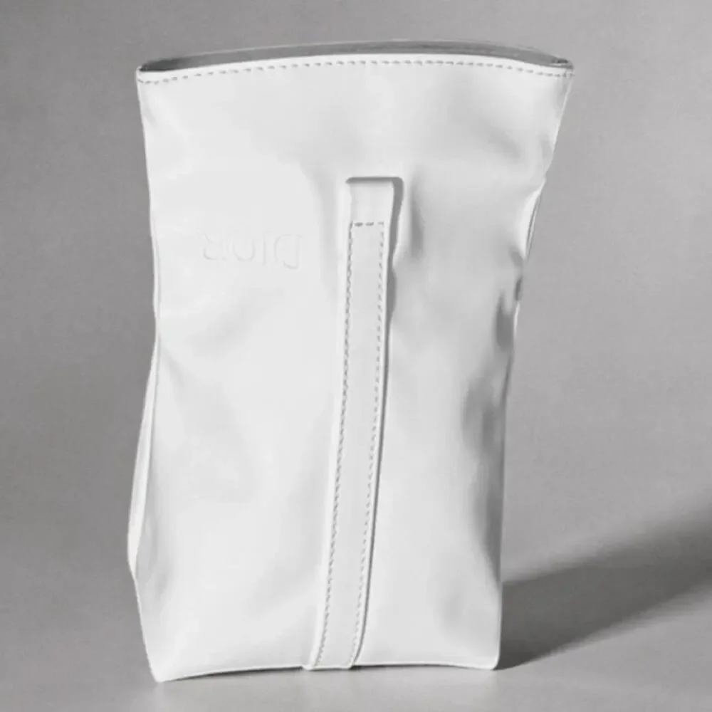Dior white roll top cosmetic pouch